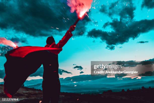 male lighting flares under the night sky - flare stack stock pictures, royalty-free photos & images