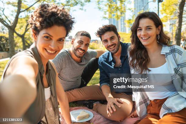 people taking a selfie at picnic in public park - rio grande do sul stock pictures, royalty-free photos & images