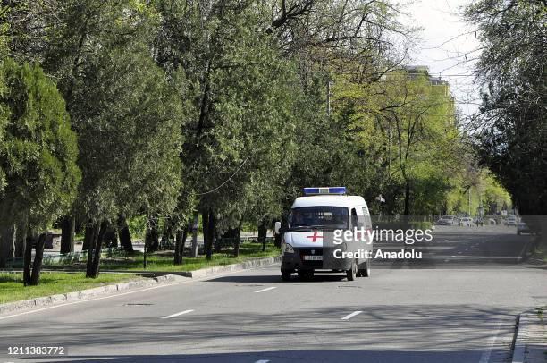An ambulance goes on an empty road during the measures against the coronavirus pandemic in Bishkek, Kyrgyzstan on April 30, 2020. State of emergency...