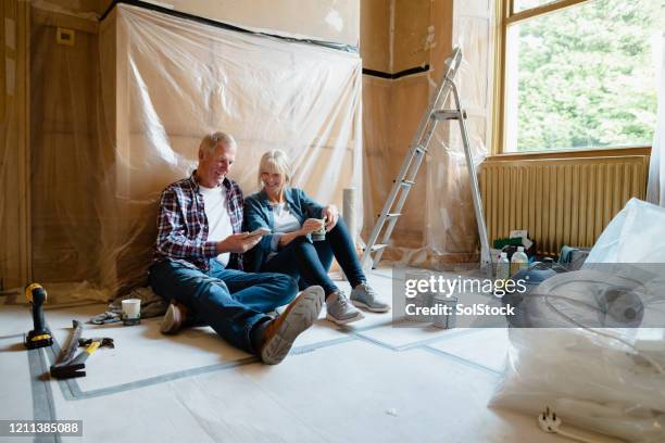 couple sitting relaxing - home renovation stock pictures, royalty-free photos & images