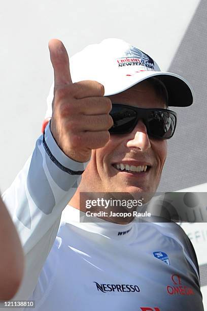 Dean Barker stands on stage after winnig in AC World Series Championship during the seventh day of America's Cup World Serieson August 14, 2011 in...