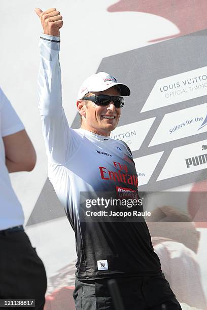 Dean Barker stands on stage after winnig in AC World Series Championship during the seventh day of America's Cup World Serieson August 14, 2011 in...