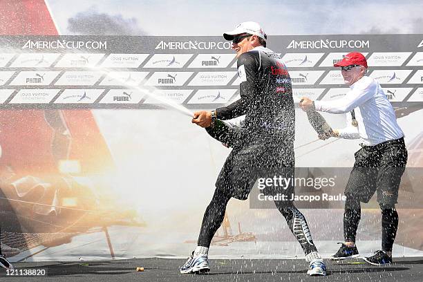 Dean Barker, Terry Hutchinson celebrate with champagna the victory in AC World Series Championship during the seventh day of America's Cup World...