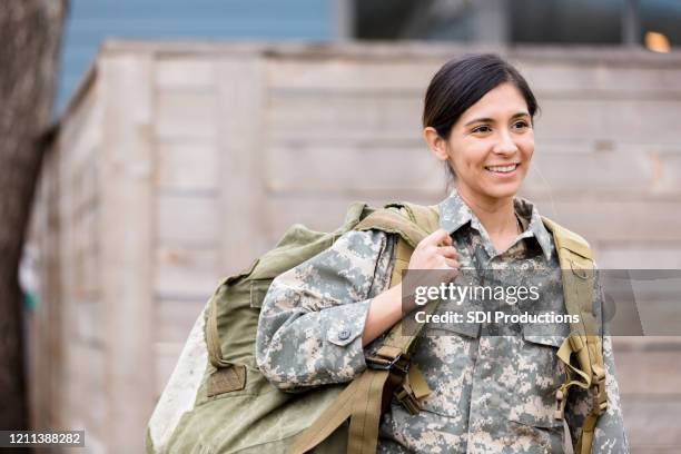 confident female soldier - military rucksack stock pictures, royalty-free photos & images