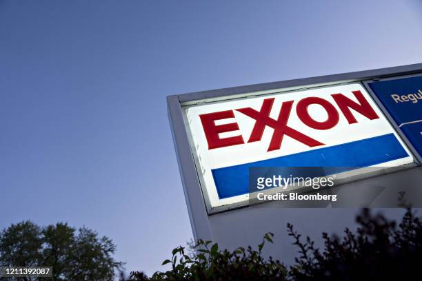 Signage is displayed at an Exxon Mobil Corp. Gas station in Arlington, Virginia, U.S., on Wednesday, April 29, 2020. Exxon is scheduled to released...