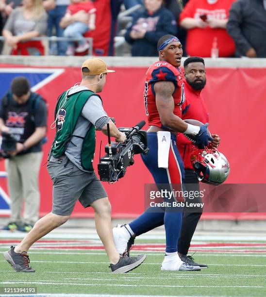 DeMarquis Gates of the Houston Roughnecks leaves the field after being injected for unsportsmanlike conduct against the Seattle Dragons during a XFL...