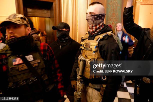 Protestors try to enter the Michigan House of Representative chamber and are being kept out by the Michigan State Police after the American Patriot...