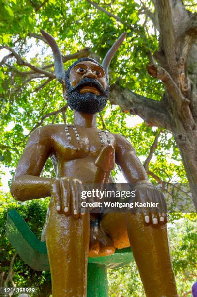 Statue of Legba the trixter god in the Sacred Forest of Kpassè Zoun in Ouidah, Benin.