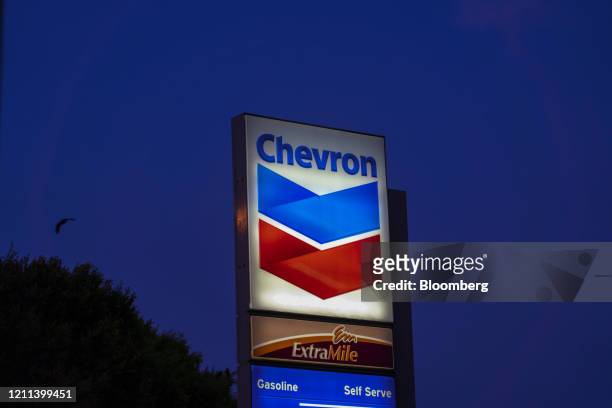 Signage is displayed at a Chevron Corp. Gas station in El Segundo, California, U.S., on Monday, April 27, 2020. Chevron is scheduled to release...