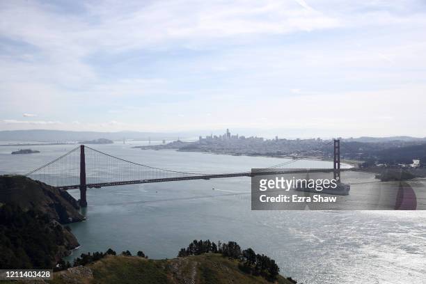 The Princess Cruises Grand Princess cruise ship travels under the Golden Gate Bridge in the San Francisco Bay to a port in Oakland, CA on March 09,...