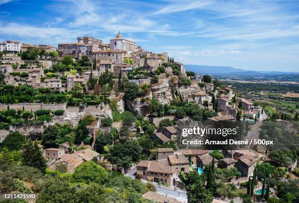 town on hill, gordes, roussillon, france - roussillon stock pictures, royalty-free photos & images