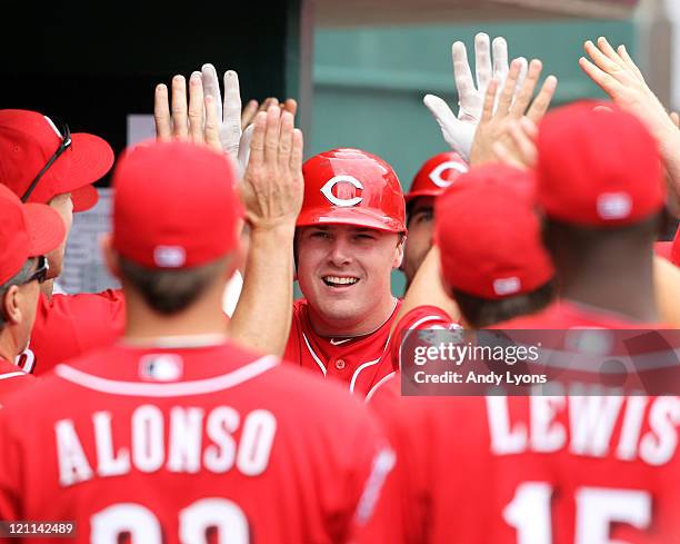 Jay Bruce of the Cincinnati Reds is congratulated by teammates after hitting a home run during the game against the San Diego Padres at Great...