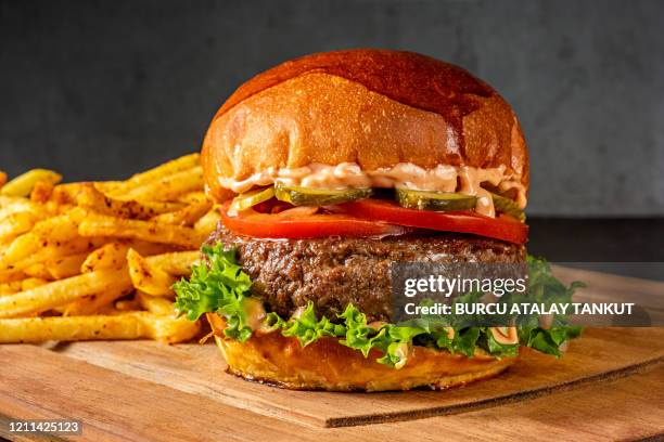 burger with french fries - juicy stock pictures, royalty-free photos & images