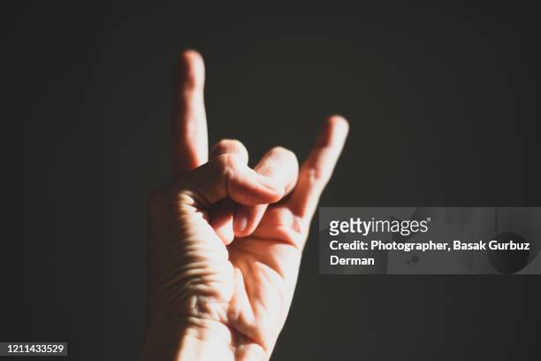 sign of the horns - heavy metal stock pictures, royalty-free photos & images