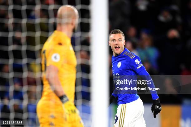 Jamie Vardy of Leicester City speaks to Goalkeeper, Pepe Reina of Aston Villa after he scores a penalty during the Premier League match between...