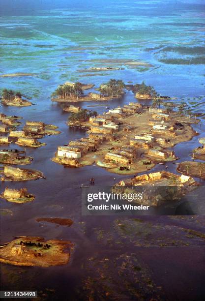 Marsh Arab villages of woven reed houses on small islands dot the landscape where the Tigris and Euphrates Rivers meet at the legendary site of the...