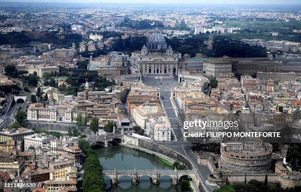 This aerial photograph taken on May 1, 2020 shows the deserted St Peter's square at the Vatican, along the Tiber river in Rome, on May day during the...