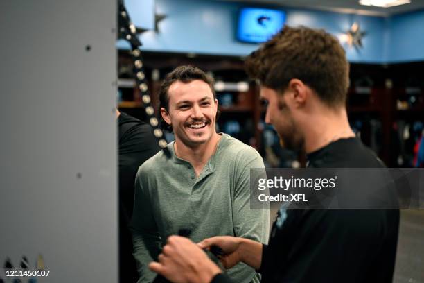 Flynn Nagel of the Dallas Renegades talks to his teammate before the XFL game against the New York Guardians at Globe Life Park on March 7, 2020 in...