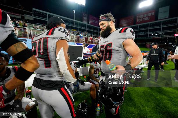 Ranthony Texada II and Ben Heeney of the New York Guardians high five during the XFL game against the Dallas Renegades at Globe Life Park on March 7,...