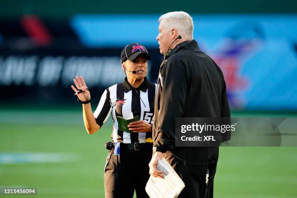 Referee Robin DeLorenzo talks to head coach Kevin Gilbride of the New York Guardians during the XFL game against the Dallas Renegades at Globe Life...