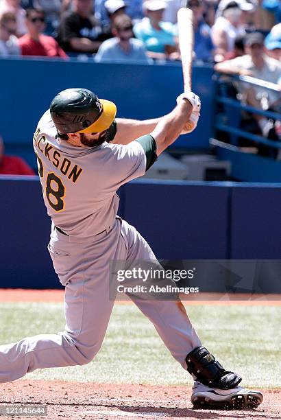 Conor Jackson of the Oakland Athletics hits during MLB action at the Rogers Centre August 11, 2011 in Toronto, Ontario, Canada.