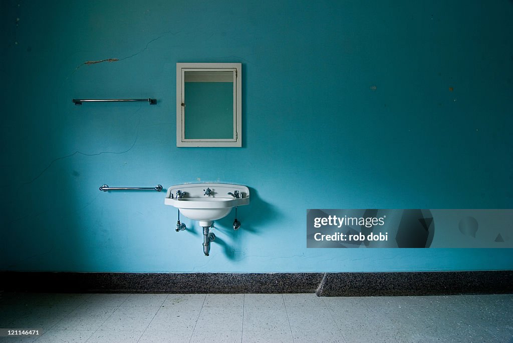 Blue room with mirror and sink