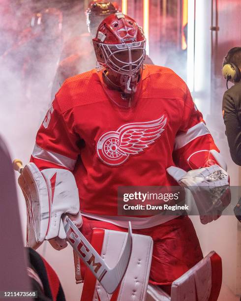 Jonathan Bernier of the Detroit Red Wings walks out to the rink for the start of the first period during an NHL game against the Tampa Bay Lightning...