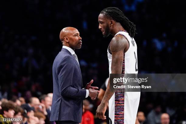 Head coach Jacque Vaughn speaks with Taurean Prince of the Brooklyn Nets against the Chicago Bulls in the first half at Barclays Center on March 08,...