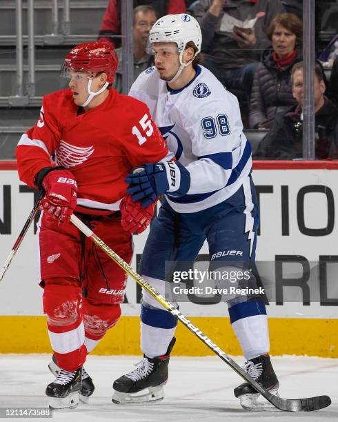 Dmytro Timashov of the Detroit Red Wings battles for position with Mikhail Sergachev of the Tampa Bay Lightning during an NHL game at Little Caesars...