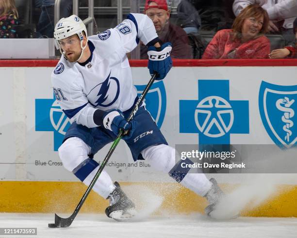 Erik Cernak of the Tampa Bay Lightning stops with the puck against the Detroit Red Wings during an NHL game at Little Caesars Arena on March 8, 2020...