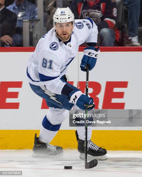 Erik Cernak of the Tampa Bay Lightning controls the puck against the Detroit Red Wings during an NHL game at Little Caesars Arena on March 8, 2020 in...