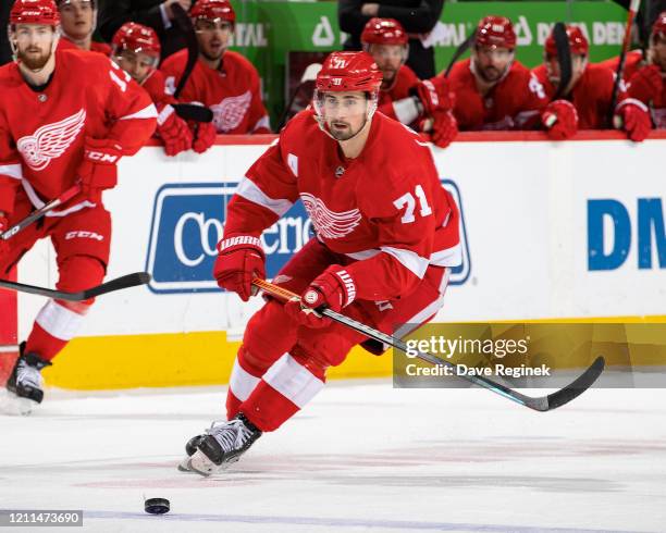 Dylan Larkin of the Detroit Red Wings skates after a loose puck against the Tampa Bay Lightning during an NHL game at Little Caesars Arena on March...