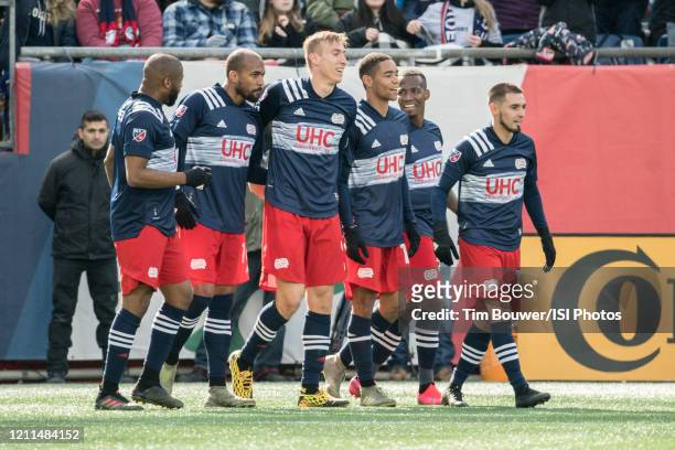 New England players celebrate their goal against Chicago during a game between Chicago Fire and New England Revolution at Gillette Stadium on March...
