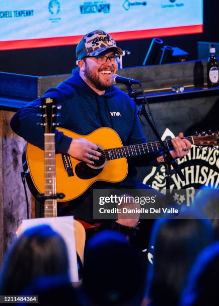 Mitchell Tenpenny performs onstage for Whiskey Row's tornado relief concert hosted by Mitchell Tenpenny & friends at Dierks Bentley’s Whiskey Row on...