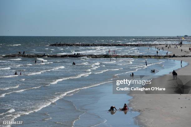 People sunbathe on the beach after it was reopened on May 1, 2020 in Galveston, Texas. As part of phase one Gov. Greg Abbott reopened the beaches to...