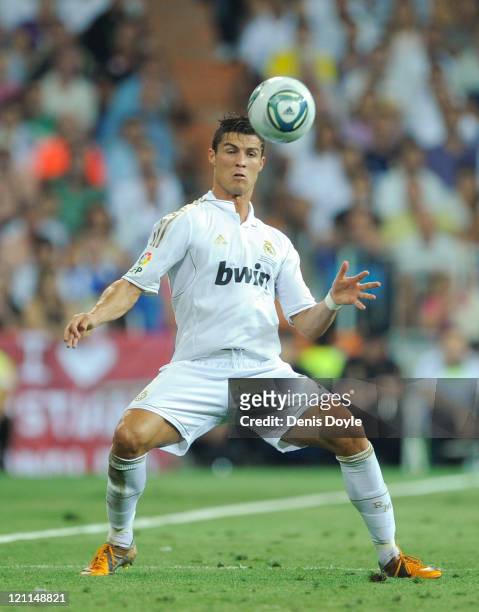 Cristiano Ronaldo of Real Madrid controls the ball during the Super Cup first leg match between Real Madrid and Barcelona at Estadio Santiago...
