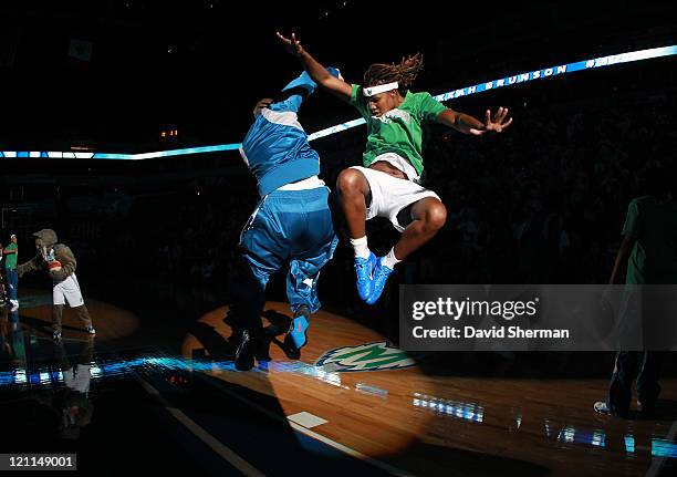 Charde Houston and Rebekkah Brunson of the Minnesota Lynx rallies pregame during the Tulsa Shock game on August 14, 2011 at Target Center in...