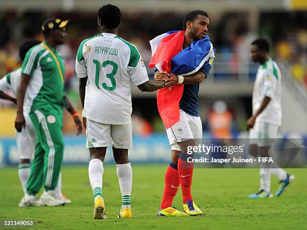 Alexandre Lacazette of France greets Emmanuel Anyanwu of Nigeria at the end of the FIFA U-20 World Cup Colombia 2011 quarter final match between...