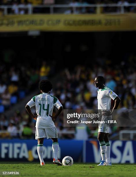 Uche Nwofor and Sani Emmanuel of Nigeria stand dejected waiting to resume the game after France scored during the FIFA U-20 World Cup Colombia 2011...