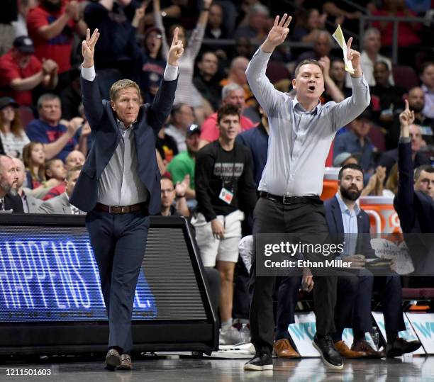 Head coach Mark Few and assistant coach Tommy Lloyd of the Gonzaga Bulldogs gesture to their players during the West Coast Conference basketball...