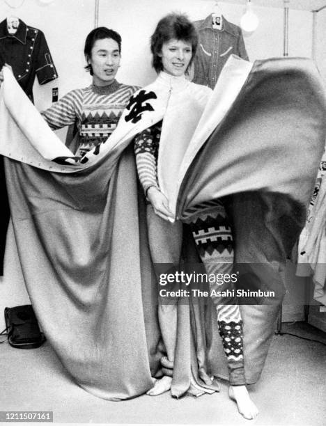 Singer David Bowie attends a costume fitting session with designer Kansai Yamamoto ahead of his performance on April 7, 1973 in Tokyo, Japan.