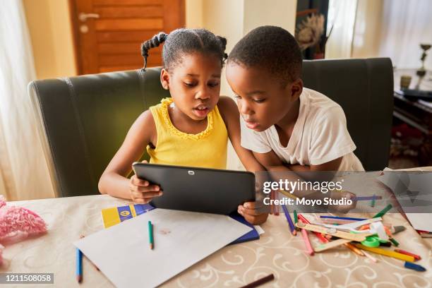 using technology to sharpen their young minds - e learning children stock pictures, royalty-free photos & images