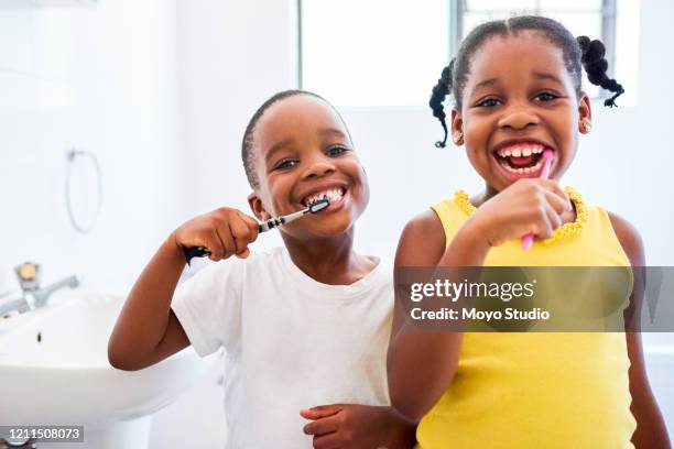 getting ready to kiss our parents good-morning - brush teeth stock pictures, royalty-free photos & images