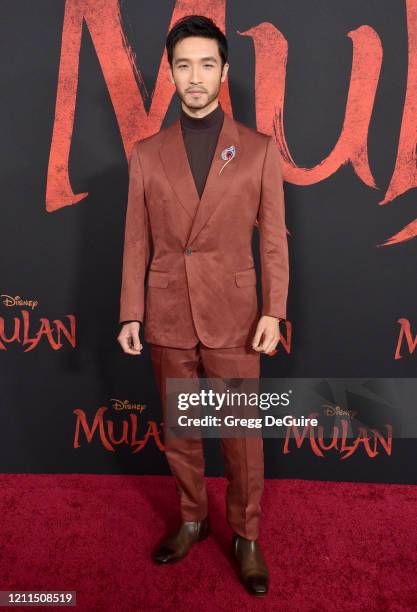 Yoson An attends the Premiere Of Disney's "Mulan" on March 09, 2020 in Hollywood, California.