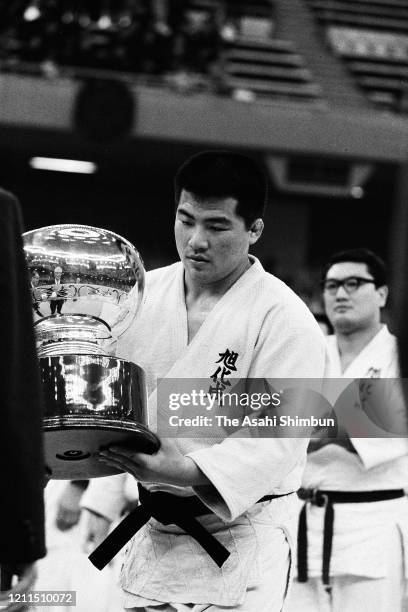 Haruki Uemura receives the trophy after winning the All Japan Judo Championship at the Nippon Budokan on April 29, 1973 in Tokyo, Japan.