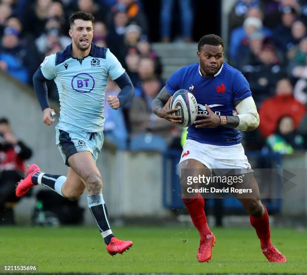 Virimi Vakatawa of France breaks away from Adam Hastings during the 2020 Guinness Six Nations match between Scotland and France at Murrayfield on...