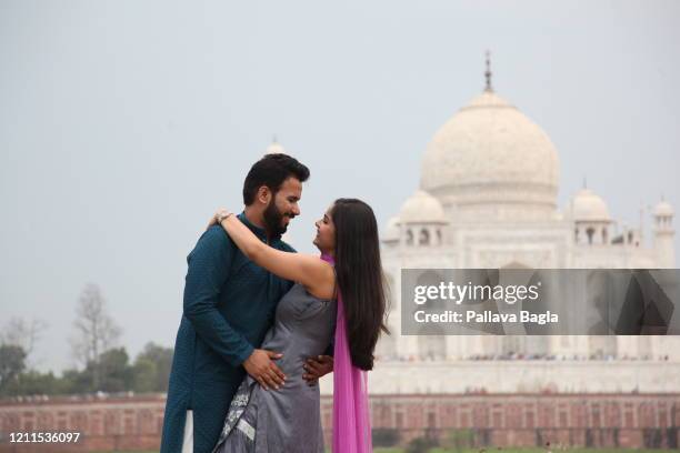 Couple visit the Taj Mahal the world famous on February 29, 2020 in Agra, India.
