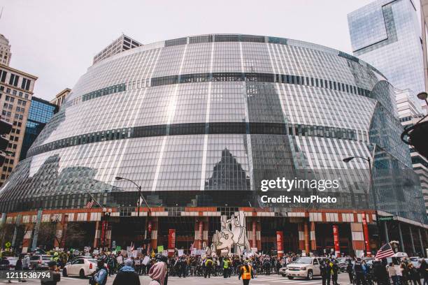 Protester at the Re-Open Illinois gathering outside the Thompson Center in Chicago IL during protest restrictions instituted by the governor to...