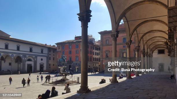 piazza della santissima annunziata, a famous monumental renaissance square in florence, italy - piazza santissima stock pictures, royalty-free photos & images