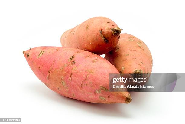 three yams - zoete aardappel stockfoto's en -beelden